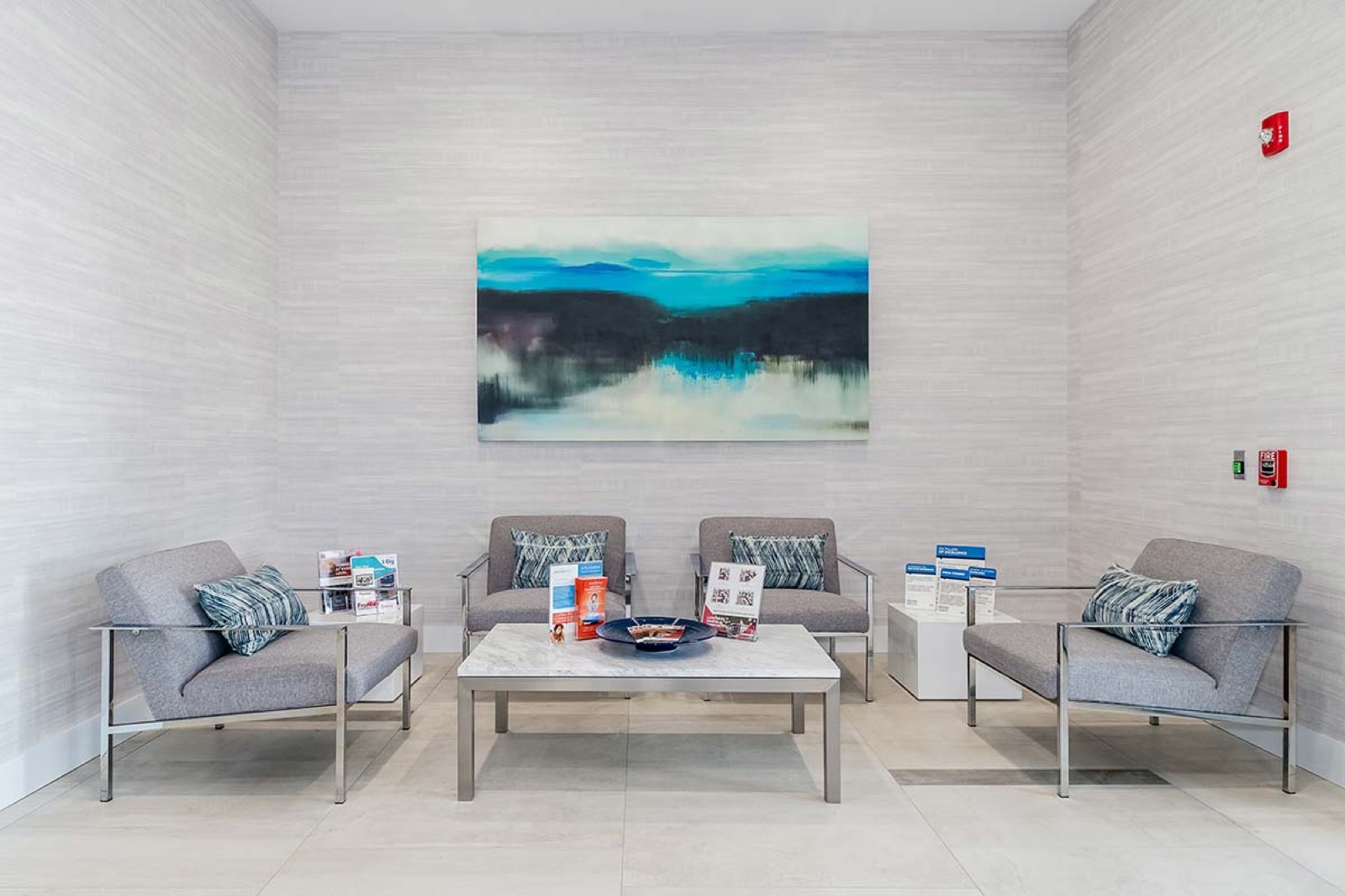 An unfurnished open plan apartment with wood-style flooring